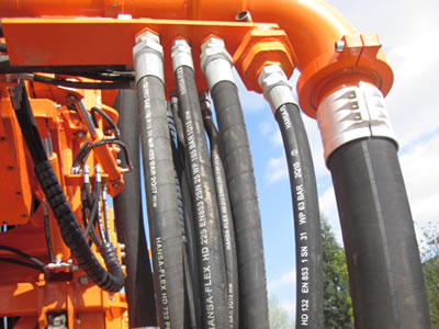 It shows some hydraulic hoses installed onto one machine.